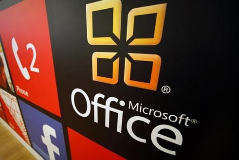 A Microsoft Office logo is shown on display at a Microsoft retail store in San Diego
